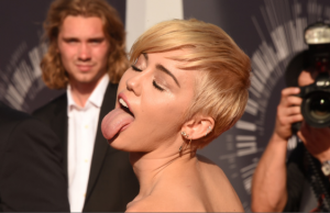 Miley Cyrus Licks Piano And Sells It For $50000!